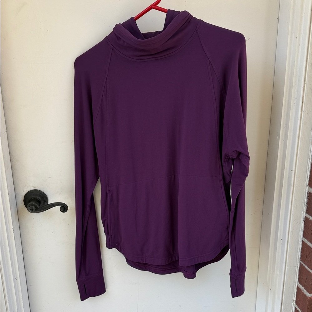 Purple Long Sleeve Lululemon top with huddles. Size L.Have two pockets,